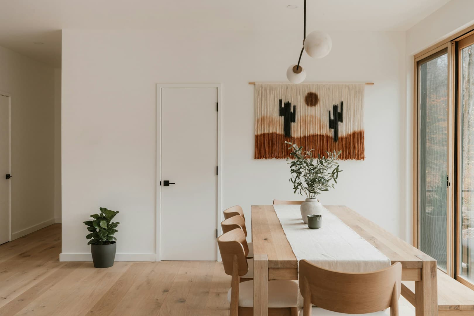 Bright, clean living room with sunlit floors and neatly arranged furniture